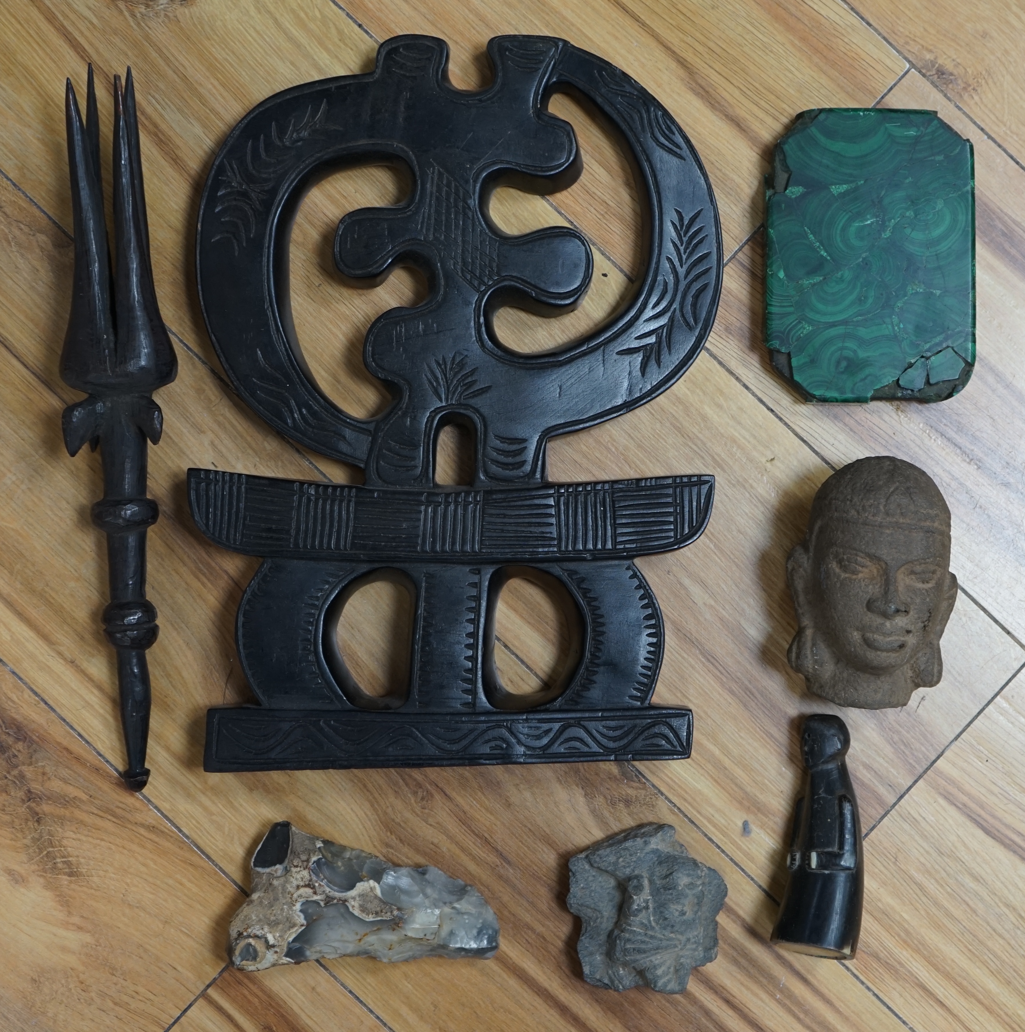 A flint axe, an inuit horn carving, a South American tribal stone head, a malachite panel, another stone carving and Chinese stand, largest 32cm. Condition - varies